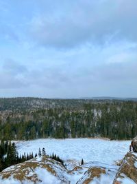 Scenic view of snow covered landscape against sky
