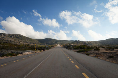 Country road with mountains in background