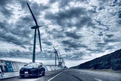 Cars on road against sky