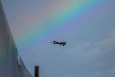 Low angle view of airplane flying in sky