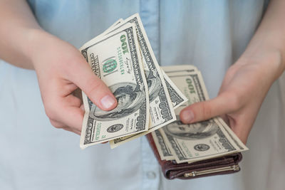 Close-up of hand holding paper