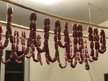 Low angle view of objects on railing against sky