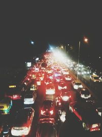 Traffic on street in city at night