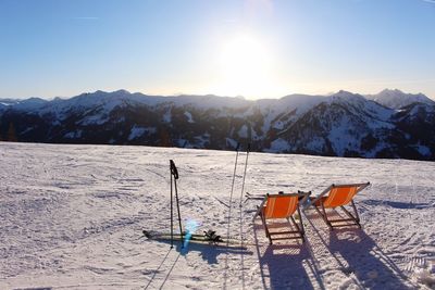 Scenic view of snow covered mountains against sky