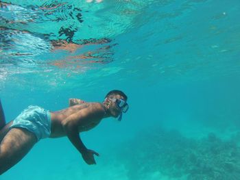 Man swimming in sea