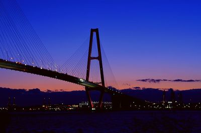 View of suspension bridge at night