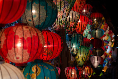 Low angle view of illuminated lanterns hanging in market