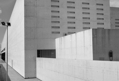 Street light by building in city