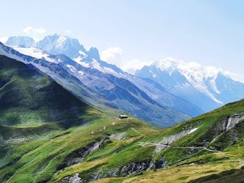 Scenic view of snowcapped mountains against sky