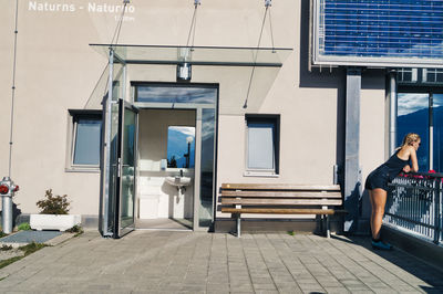 Rear view of man sitting on chair