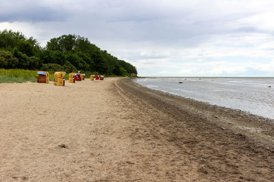 Scenic view at beach on poel island at the baltic sea, germany with beach chairs and say