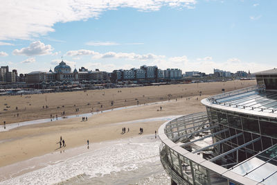 Panoramic view of people in front of building