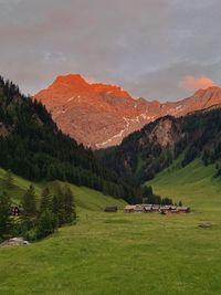 Scenic view of landscape and mountains against sky