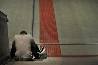 Full length of woman standing on railing