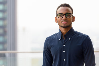 Portrait of young man standing outdoors