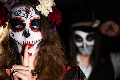 Portrait of young woman with mask