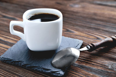 Close-up of coffee cup on table