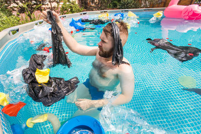 High angle view of man swimming in pool