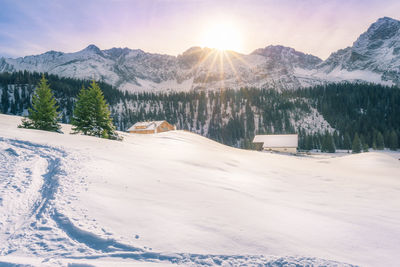 Scenic view of snowcapped mountains against bright sky