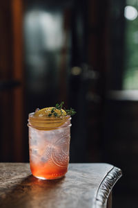 Strawberry thyme lemon cocktail drink in mason jam jar summertime