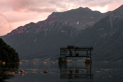 Scenic view of lake against sky at sunset