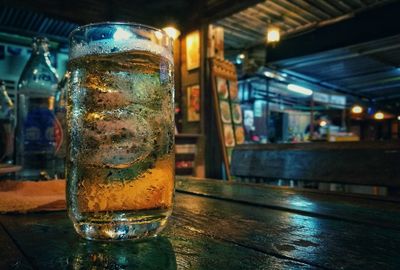 Close-up of beer glass on table