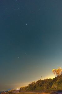 Scenic view of landscape against sky at night