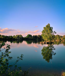 Scenic view of lake against blue sky