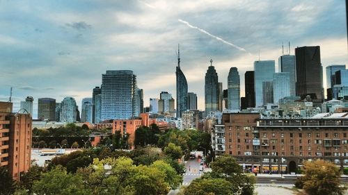 Buildings in city against sky