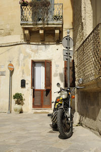 Bicycle parked outside building