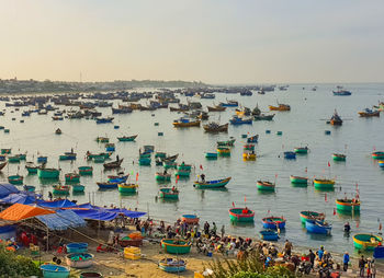 Scenic view of busy fish market at the beach which is located in mui ne, vietnam.