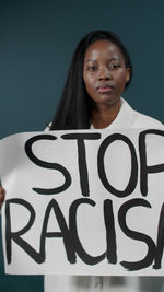 Portrait of woman holding banner