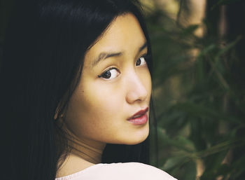 Beautiful chinese teen among bamboo forest iv