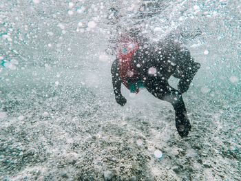 High angle view of man swimming in sea