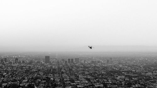 Aerial view of cityscape against sky