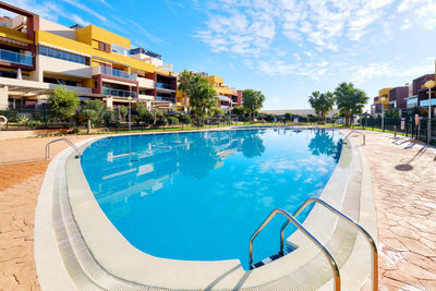 Scenic view of swimming pool against sky