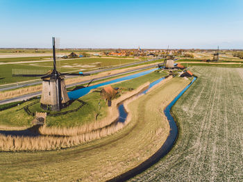 Scenic view of agricultural field against clear sky