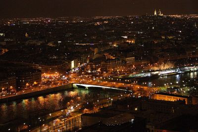 High angle view of illuminated city buildings at night