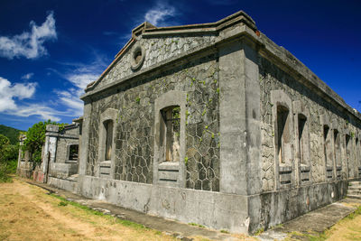 Low angle view of built structure against blue sky