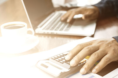 Man using laptop on table