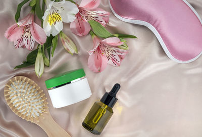 High angle view of pink flower on table