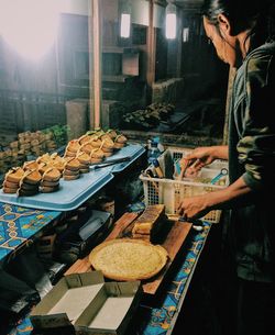 Man preparing martabak, one of indonesian food at market stall