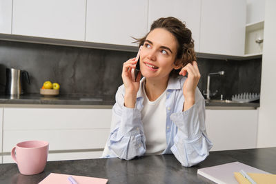 Young businesswoman working at table