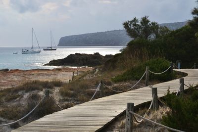 Scenic view of calm sea against blue sky