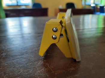 Close-up of yellow toy on table at home