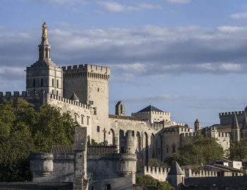 Buildings in city against sky