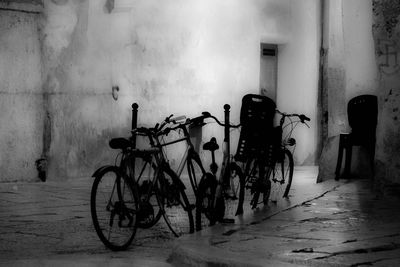 Bicycle parked on wall of building