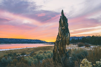 Scenic view of land against sky during sunset