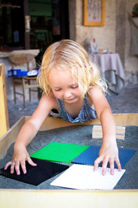 Portrait of girl playing with toys