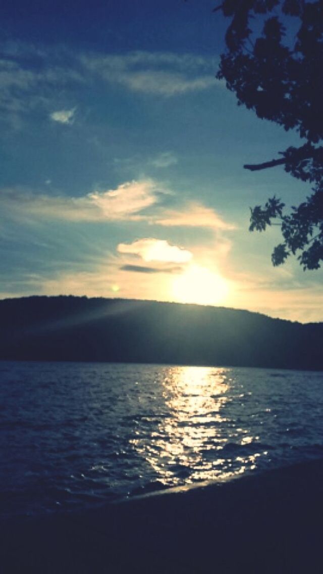 water, tranquil scene, sunset, scenics, sky, tranquility, silhouette, beauty in nature, nature, cloud - sky, mountain, lake, idyllic, cloud, reflection, sea, sun, sunlight, tree, outdoors